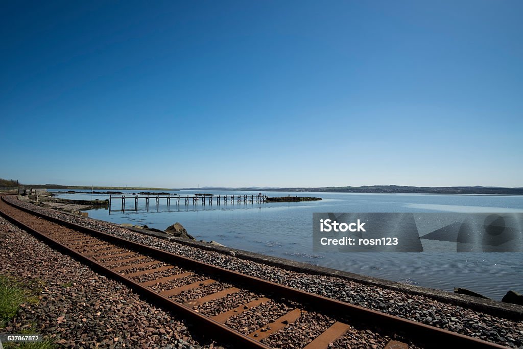 Railway track and pier, Culross, Scotland Railway track running alongside the Firth of Forth at Culross, Fife, Scotland Copy Space Stock Photo