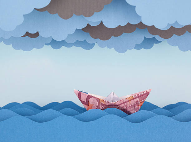 istock Euro boat in storm. Paper waves and clouds 537870116
