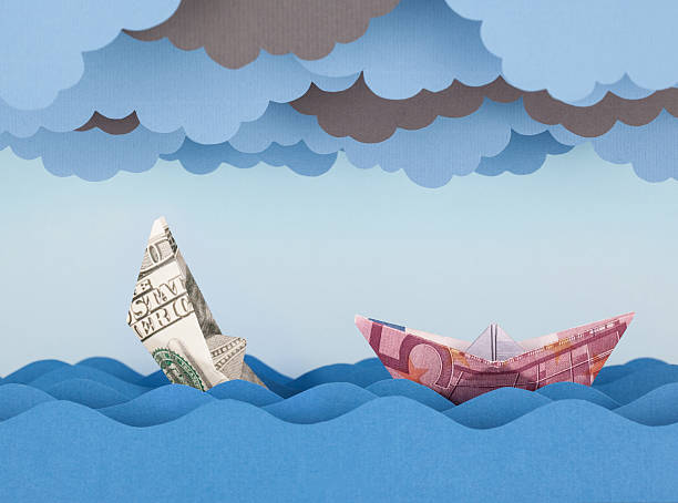 istock Dollar and Euro boat in storm. 537870676