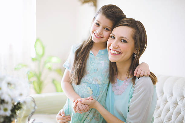 Happy mother posing with her daughter