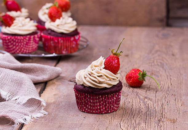 istock freshly baked cupcakes with strawberry 537871184