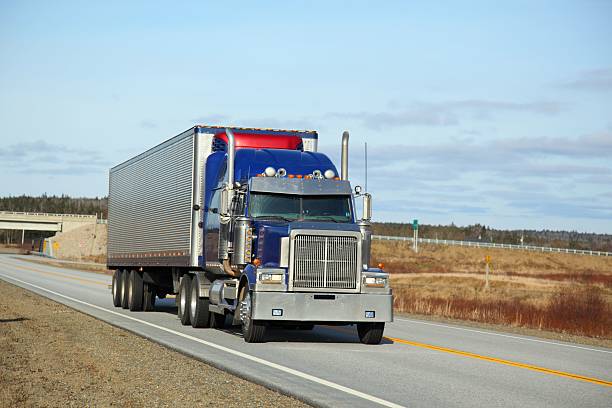 istock Semi-truck on a highway 537871297