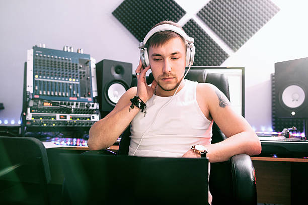 istock DJ listening music in sound recording studio 537872008
