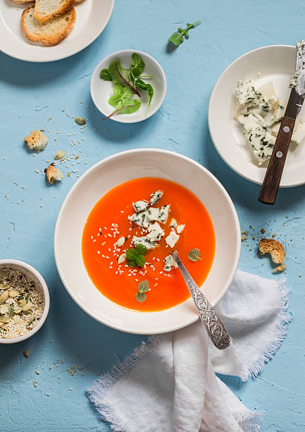 istock Pumpkin soup with blue cheese on a blue stone background 537872204