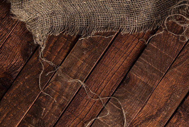 istock Old jute texture on wooden table background 537872970