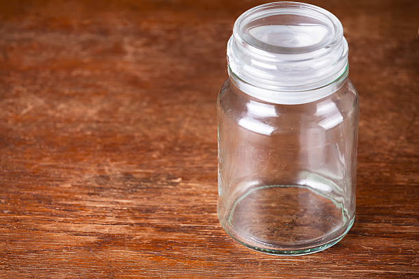 istock Empty jar dark wooden background savings. 537873044