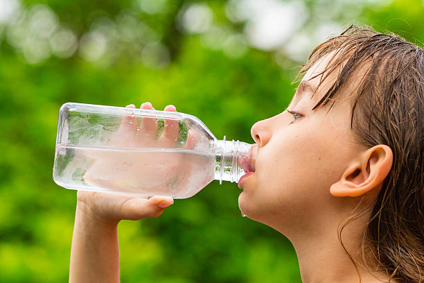 istock Child drinking clean tap water from transparent plastic bottle 537874428