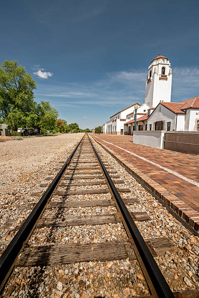 istock Railroad tracks lead past a local train depot 537874652