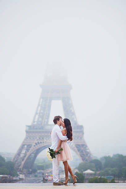 istock Beautiful romantic couple near the Eiffel tower in Paris 537875044
