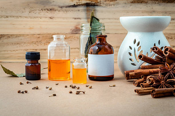 istock Bottle of essential oil with cinnamon stick . 537875400