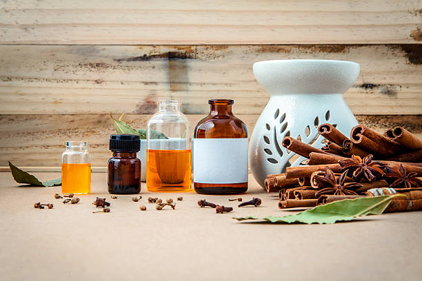 istock Bottle of essential oil with cinnamon stick . 537875558