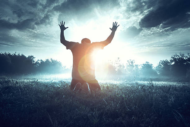 istock Prayer in the morning in a beautiful sunrise 537875576