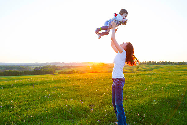 istock Happy mother and son at sunset sunlight. 537877166
