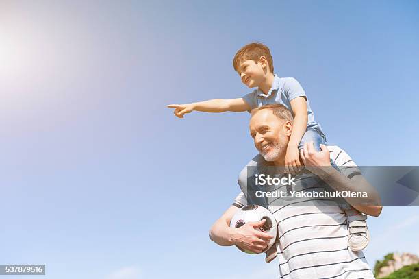 Cute Grandson And Grandparent Are Playing In Park Stock Photo - Download Image Now - Grandfather, Shoulder, Child