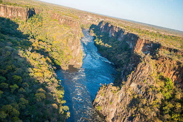 istock Aerial view of sunlit canyon and rapids 537883288