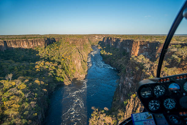 istock Aerial view of sunlit canyon from helicopter 537883422