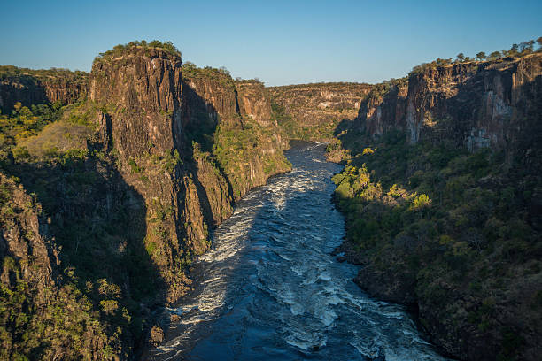 istock Aerial view of sunlit rapids from helicopter 537883666