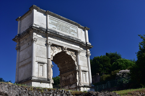 Ancient triumphal arch dedicated to Emperor Titus, at the entrance of the Roman Forum (1st century A.D.)