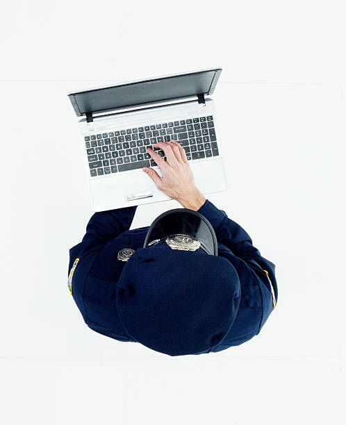 istock Above view of police working on laptop 537885576