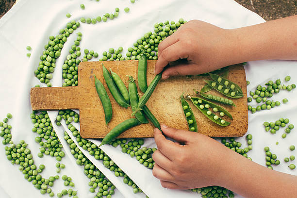 Fresh raw green beans on a chopping board