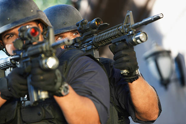 istock Police Officers Aiming With Guns 537888983