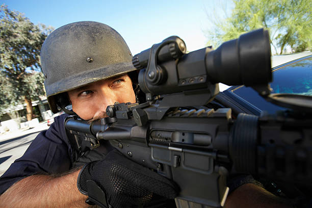 istock Policeman Aiming With Gun Outdoors 537889003