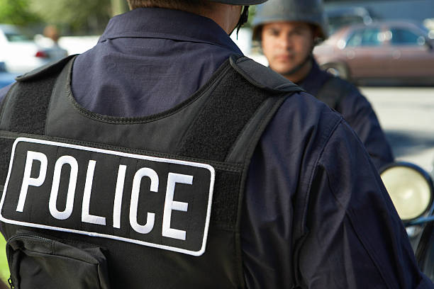 istock Policeman Wearing Protective Vest Outdoors 537889025