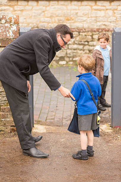 istock Father Dropping Hesitant Child to School 537889325