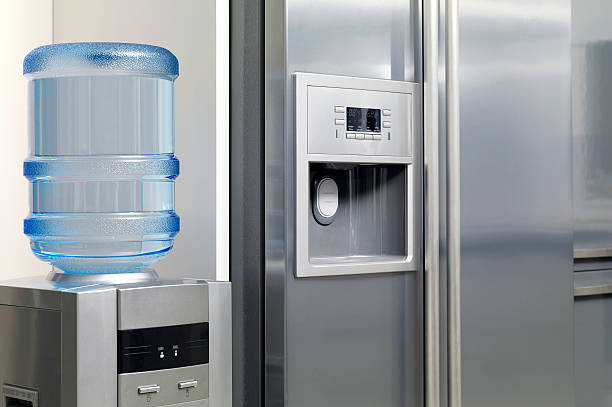 istock Modern kitchen appliance, refrigerator and water dispenser 537889605