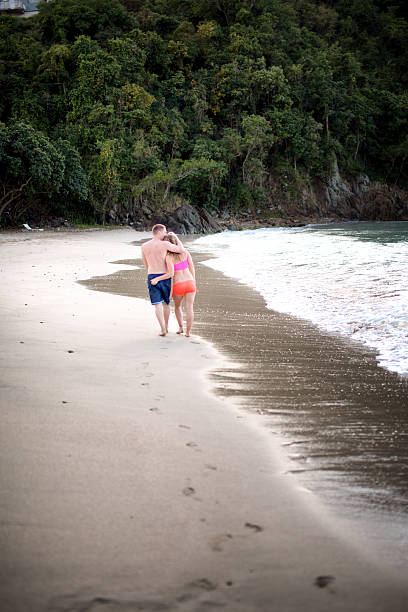 istock Couple Walking on the Beach 537890895