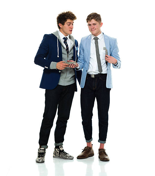 istock Smiling brothers holding money 537891302