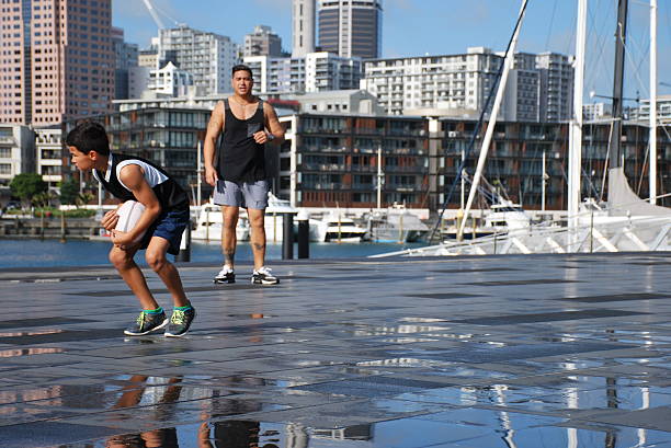 istock Pacific Island Man and Boy playing Rugby 537896800
