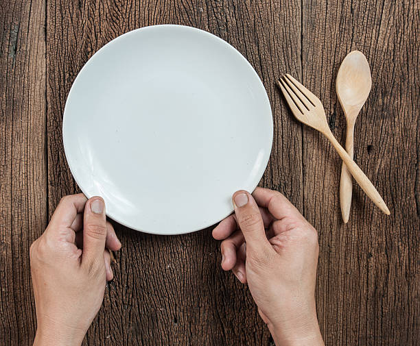 istock Top view of hand hold a empty bowl with spoon 537896944