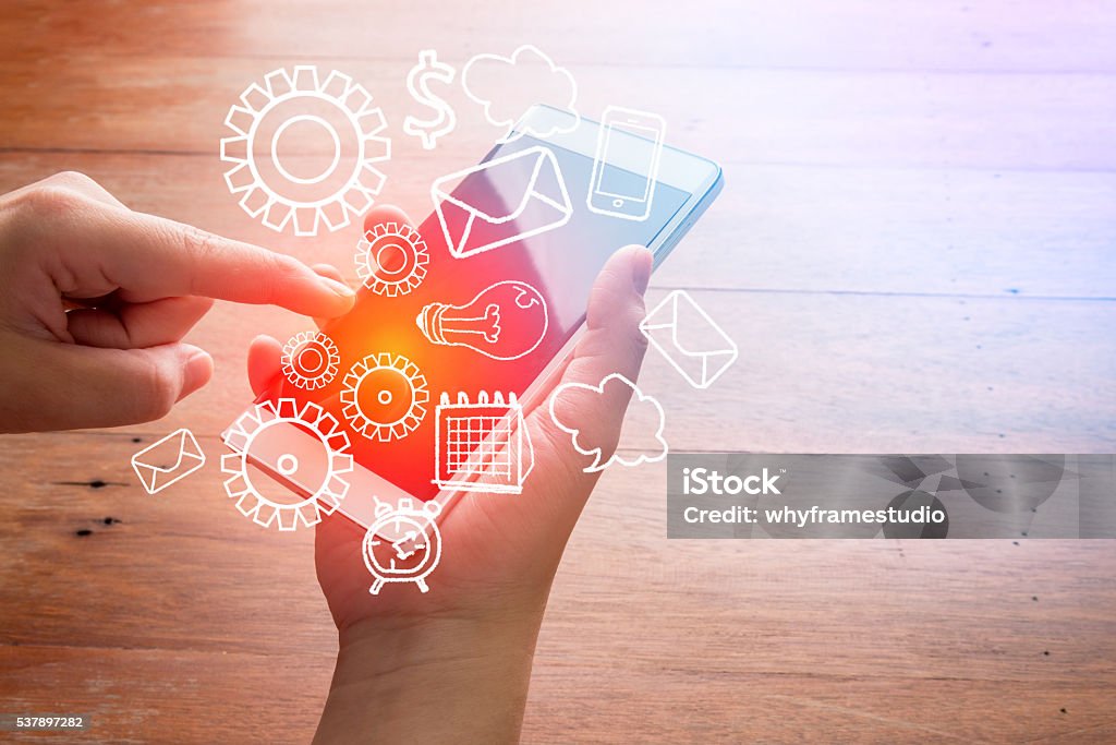 Smartphone with finance and market icons Smartphone with finance and market icons and symbols concept Adult Stock Photo