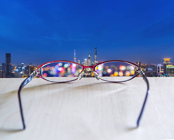 istock Night cityscape focused in glasses lenses 537897482