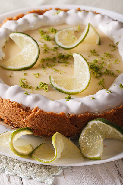istock Gourmet lime tart with whipped cream and peel closeup. Vertical 537898382