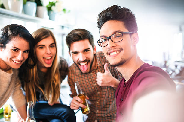 istock group of friends take a selfie during the party 537901002