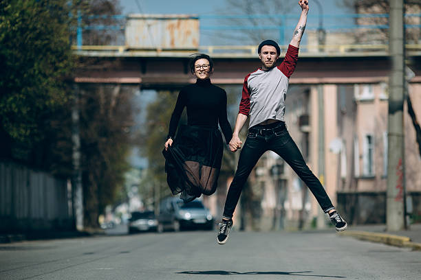 istock Beautiful young couple jumping 537901076