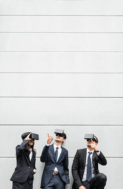 istock japanese business persons using the VR simulator on the city 537902066