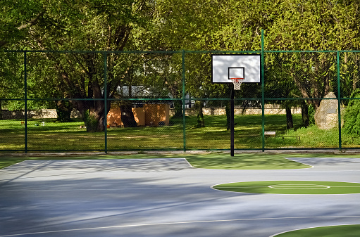 Orange Basketball Ball on Wooden Parquet. 3D Render