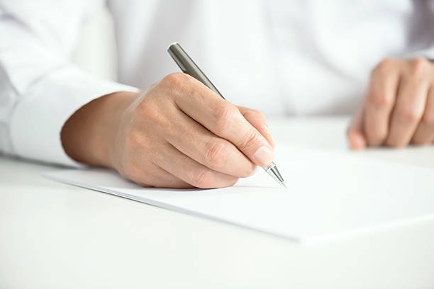 Man Signing Contract Paper Man signing contract paper, horizontal animal finger stock pictures, royalty-free photos & images