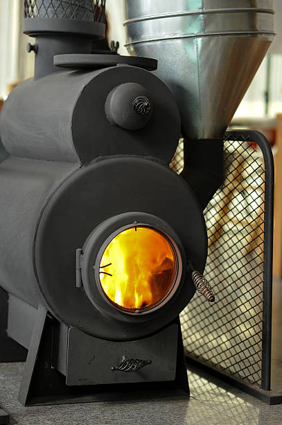 istock Burning Cast Iron Wood Stove Heating 537925031