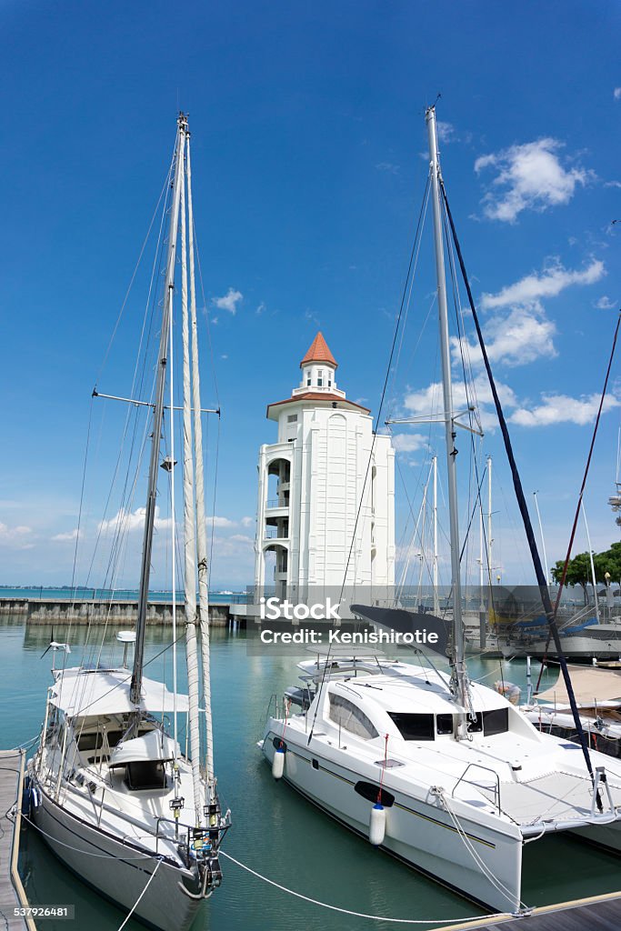 Yachts at Strait Quay lighthouse Yachts at Strait Quay lighthouse in Penang, Malaysia 2015 Stock Photo
