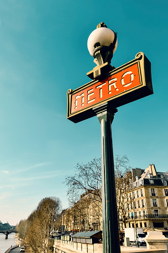 Metro sign in Paris, France. Teal and orange color grading.