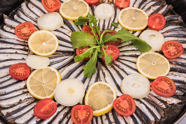 anchovy fish preparation on oven pan, hamsi tava stock photo