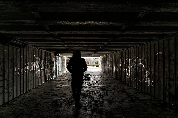 istock Silhouette of a man in tunnel 537950589