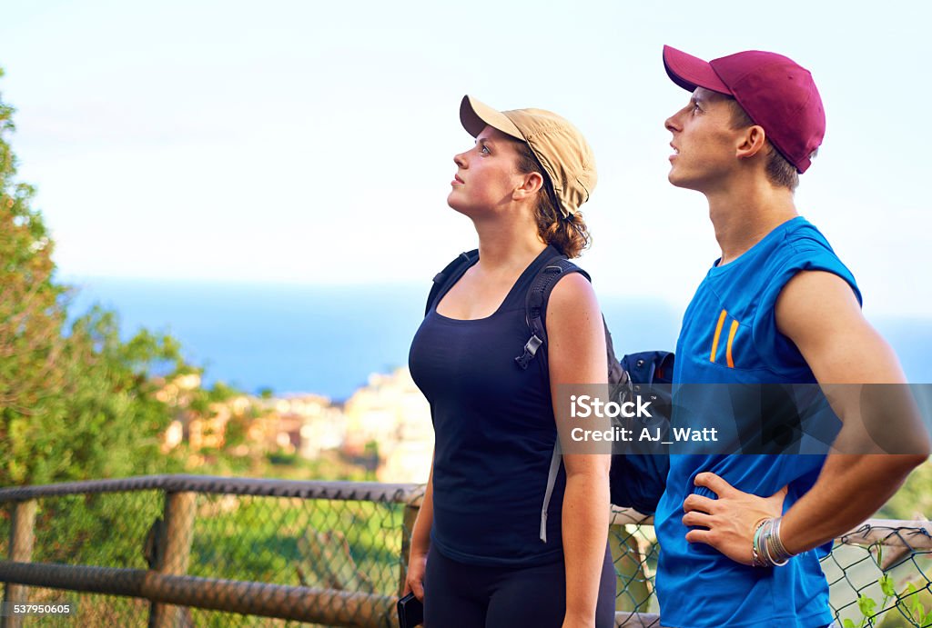 Enjoying the views Shot of a young couple enjoying the view while on a hike 20-29 Years Stock Photo