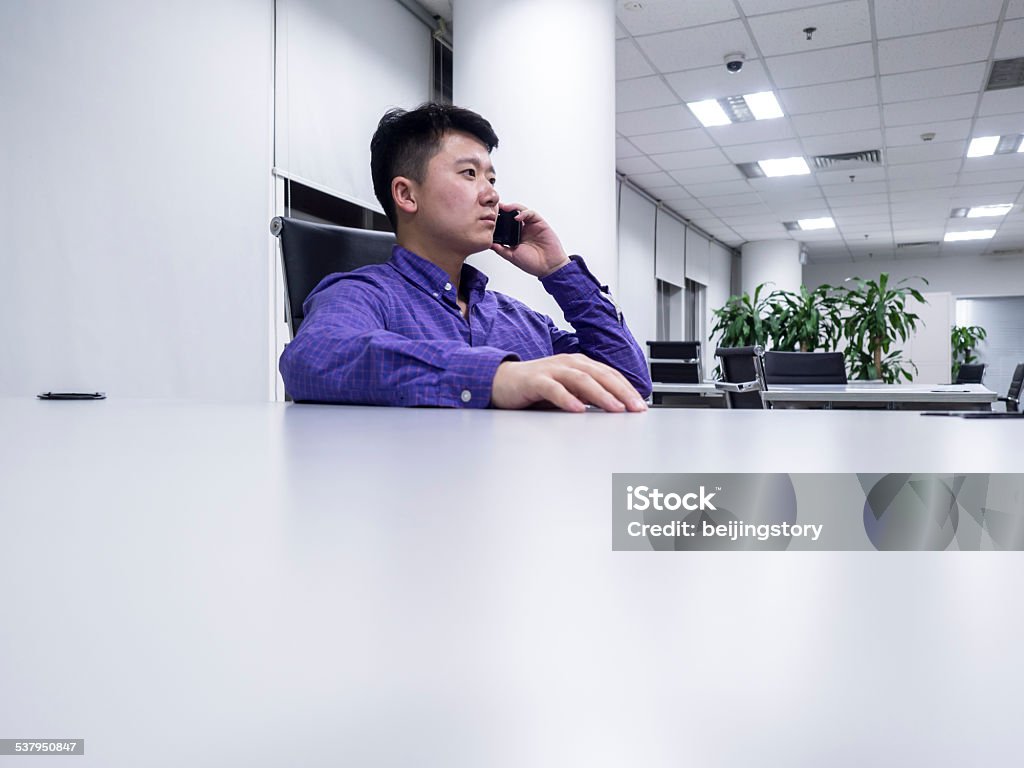 Asian businessman using telephone 2015 Stock Photo
