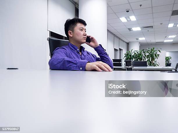 Asian Businessman Using Telephone Stock Photo - Download Image Now - 2015, Adult, Adults Only