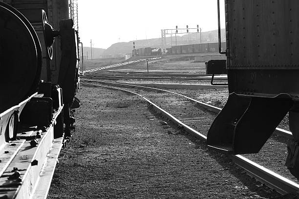 istock Railroad yard as seen between two trains cars. 537953189